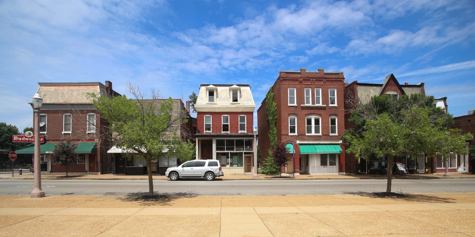 Shops and storefronts on Meramec across from St. Anthony of Padua.