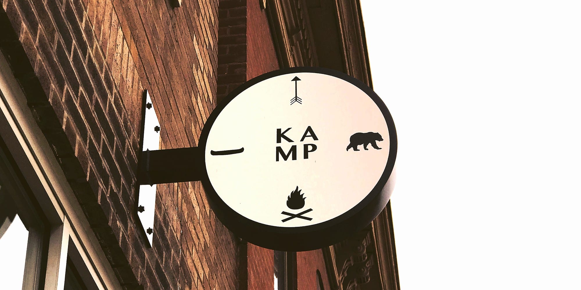 KAMP storefront sign.