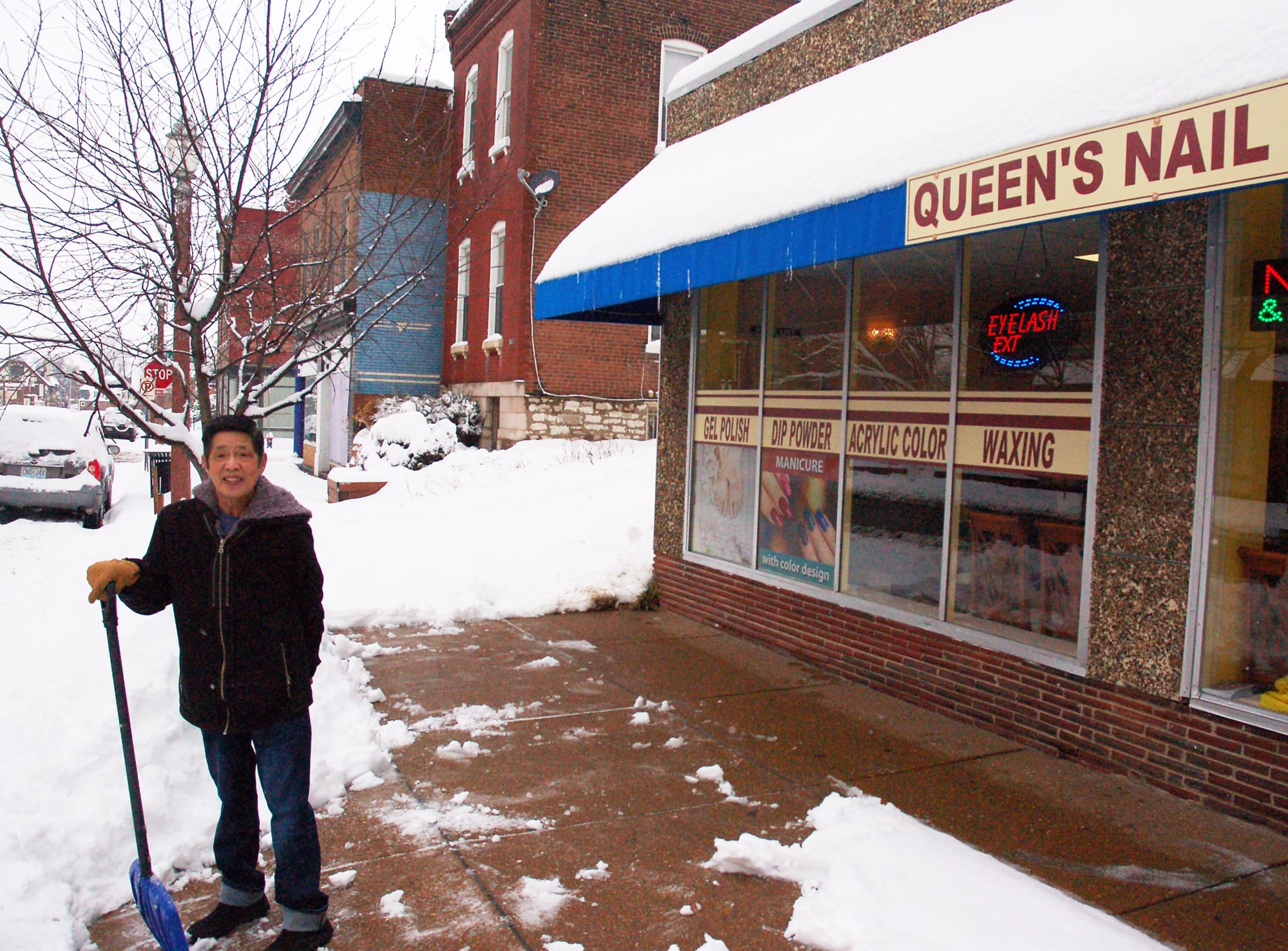 Queen's Nail and Spa on Meramec Street is open in the snow.