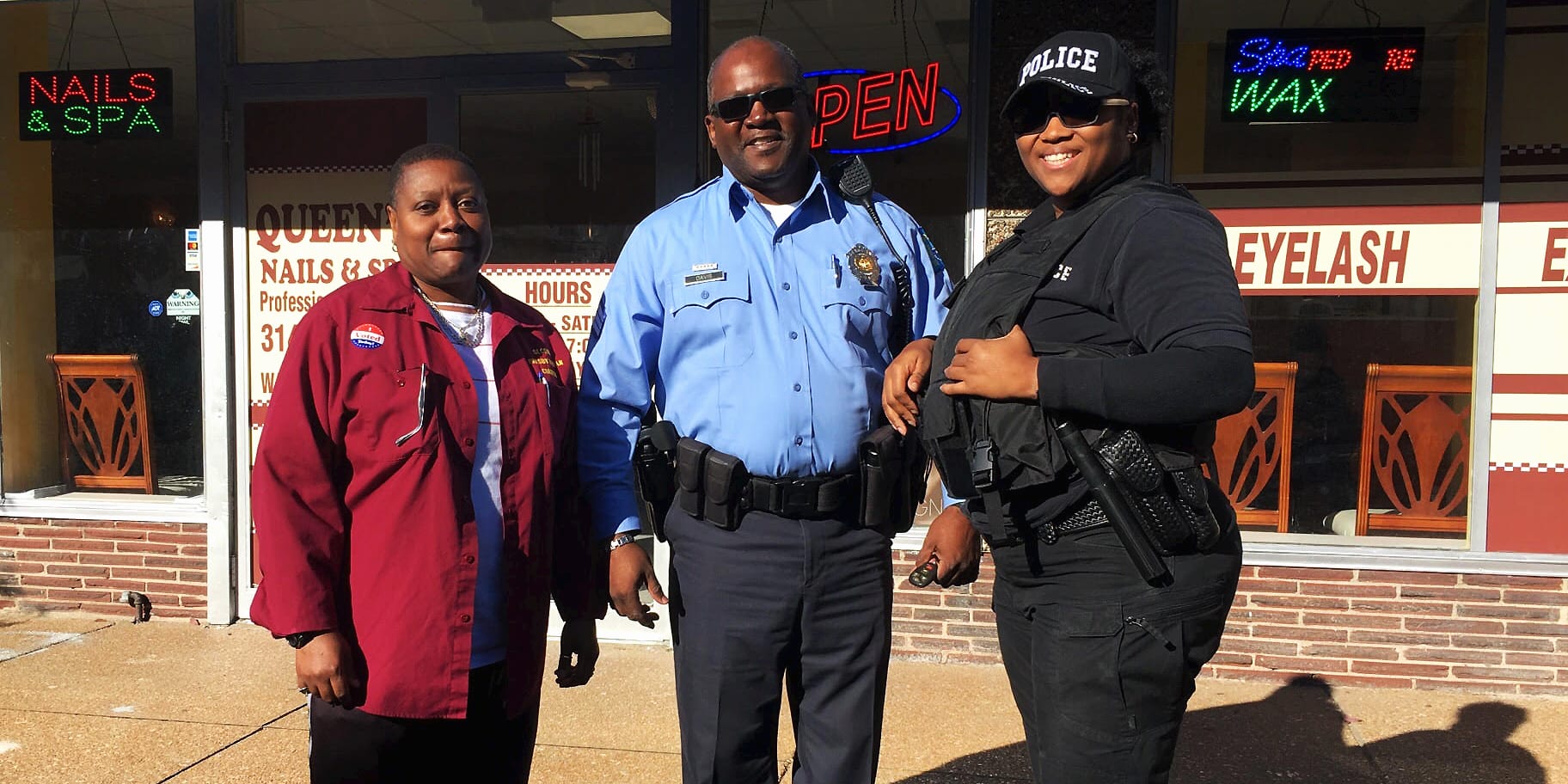 Police officers from Campbell Security Group patrolling outside of Queens Nail Salon on Meramec Street in Downtown Dutchtown.