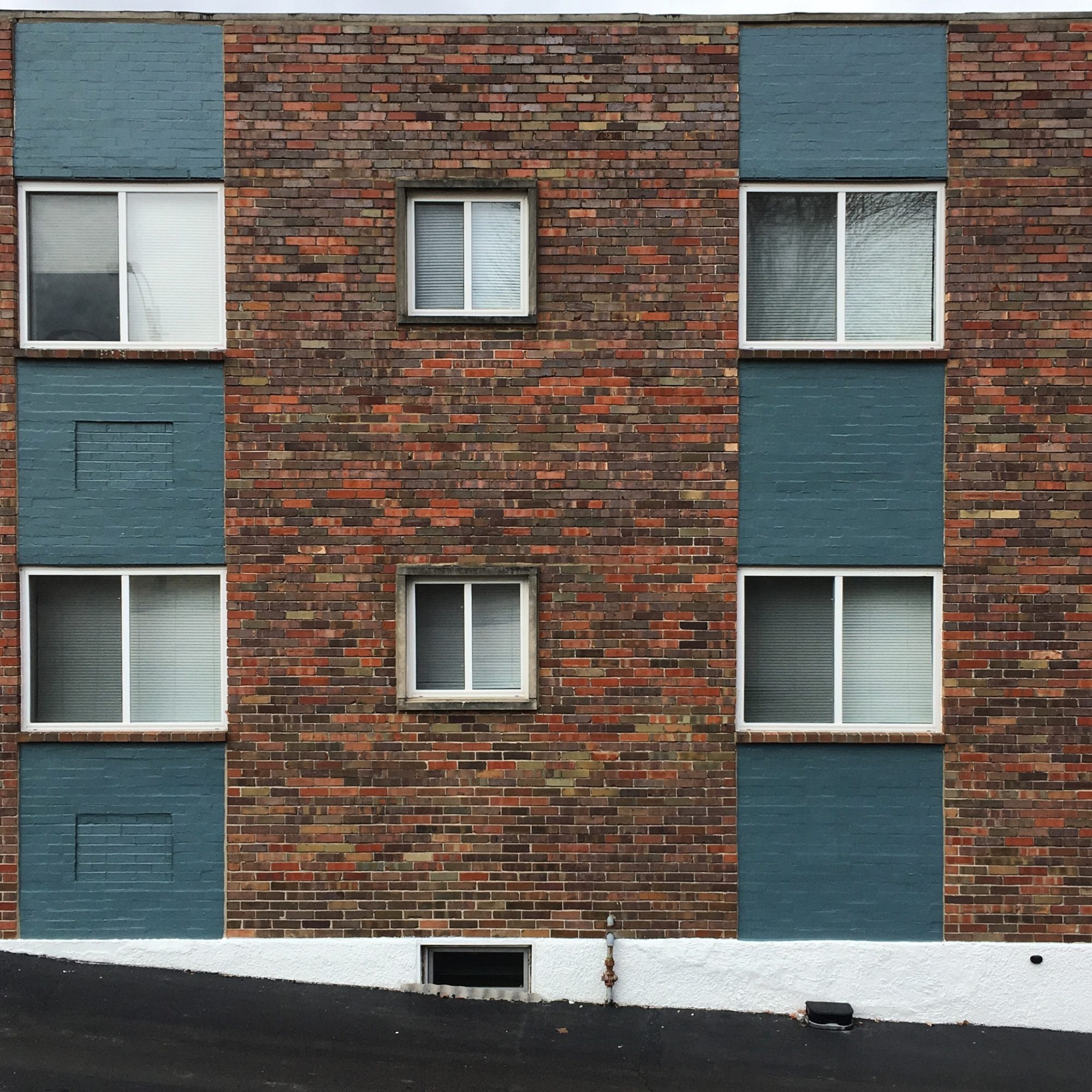 Windows on an apartment building in Dutchtown, St. Louis. Photo by Josh Burbridge.