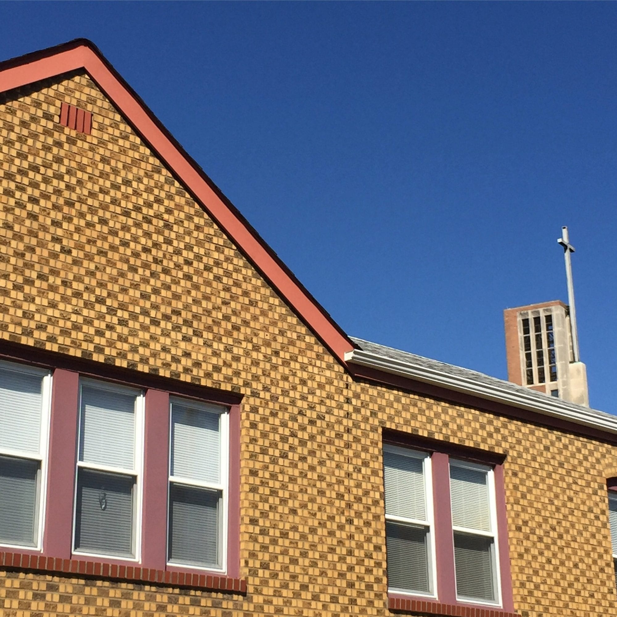 Golden bricks and the steeple of Resurrection Catholic Church in Dutchtown, St. Louis. Photo by Josh Burbridge.
