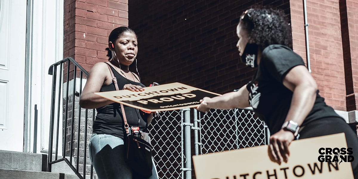 Dutchtown neighbors distribute Dutchtown Proud signs.