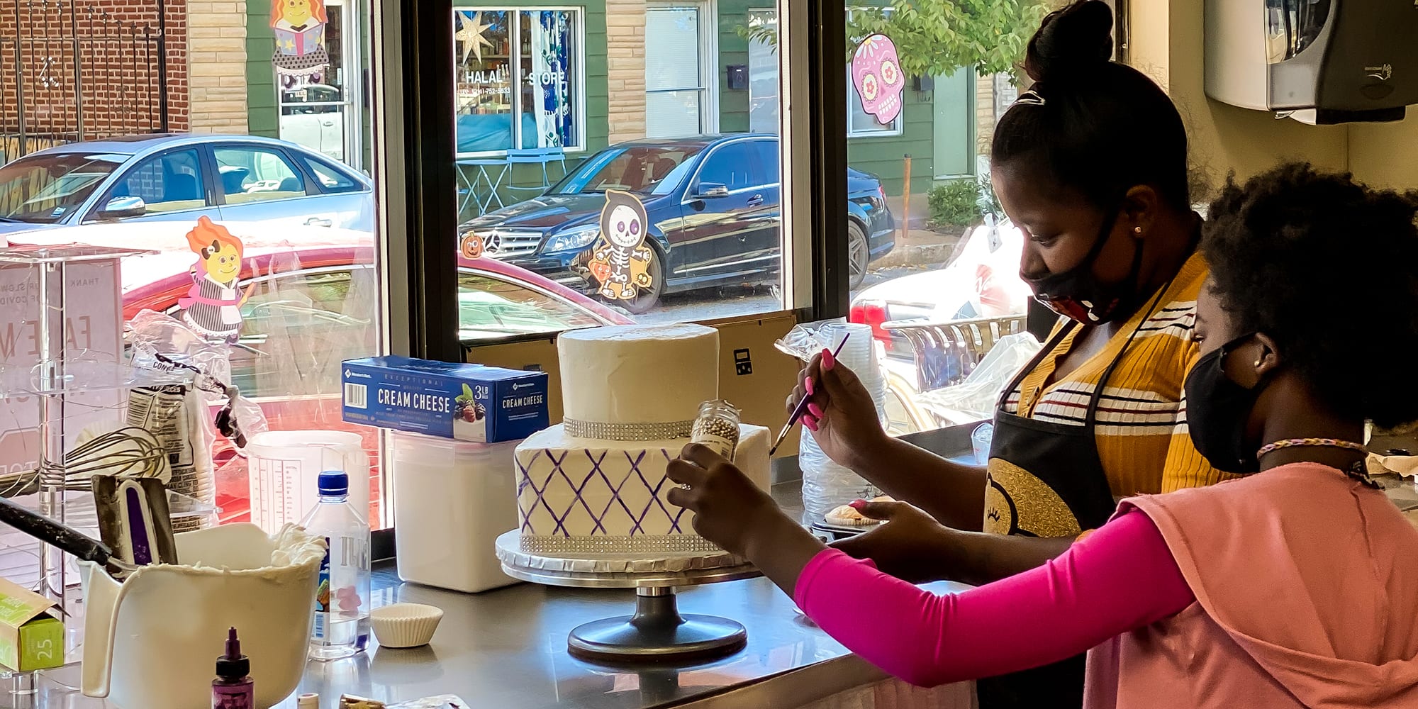 Cake decorating at Pies and Surprise in Downtown Dutchtown, St. Louis.