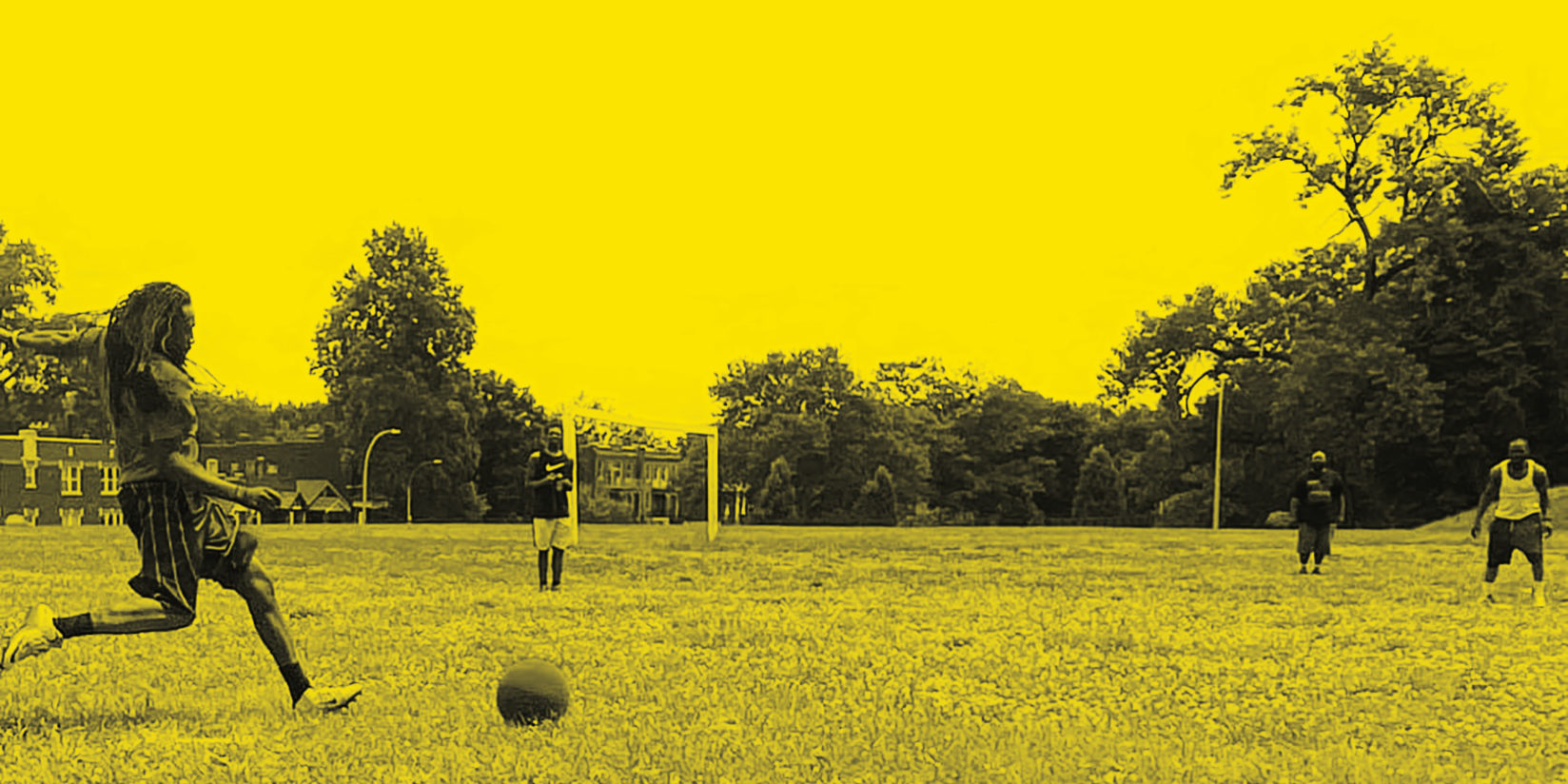 A kickball game in Marquette Park at the Marquette Community Day kickball tournament.