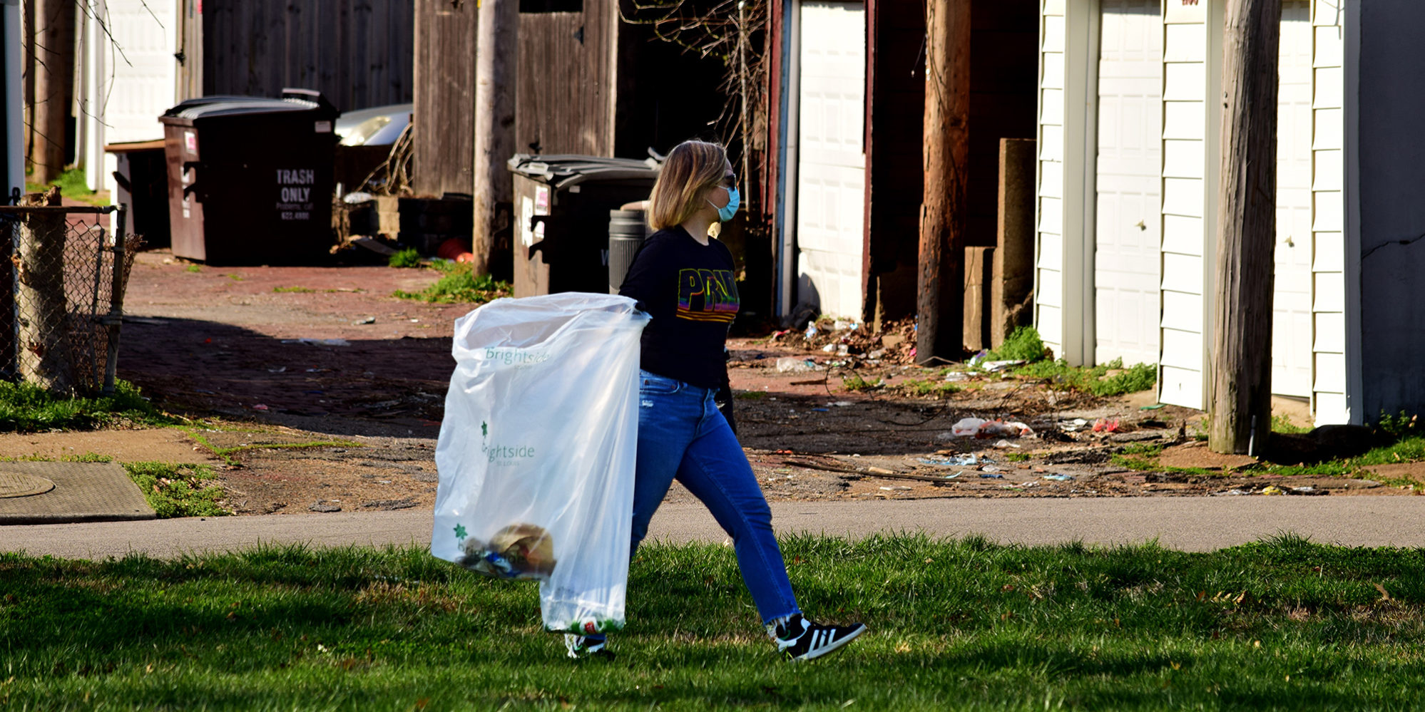 A neighbor cleans up Marquette Park in Dutchtown, St. Louis, MO.