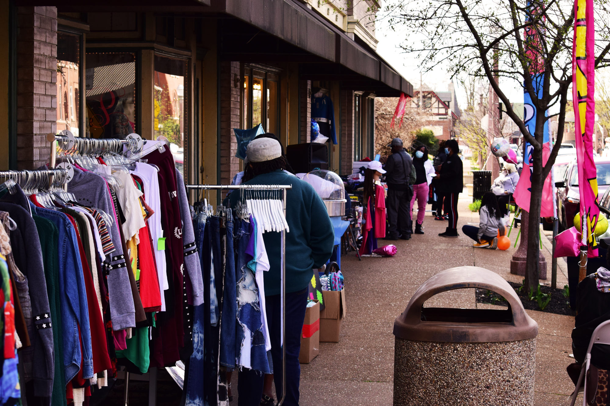 Customers shop the sidewalk sale on Meramec Street in Downtown Dutchtown, St. Louis, MO.