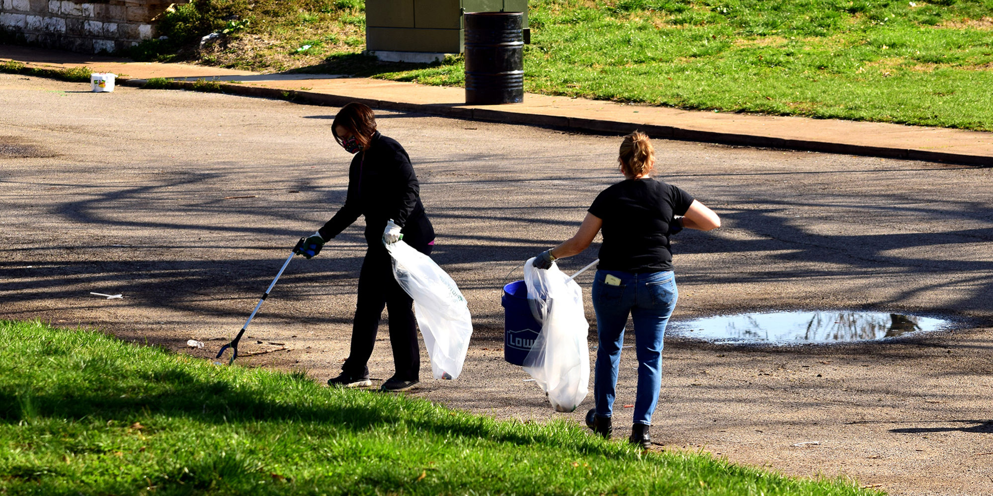 Neighbors cleaning up Marquette Park in Dutchtown, St. Louis.
