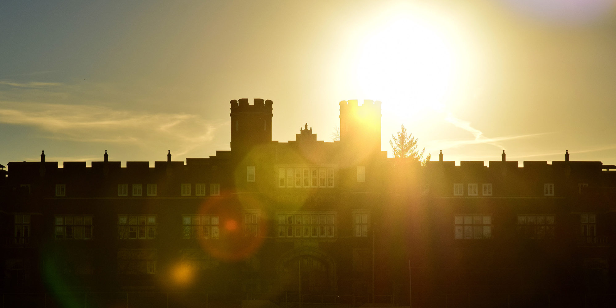 The sun rising behind Cleveland High School in Dutchtown, St. Louis, MO.