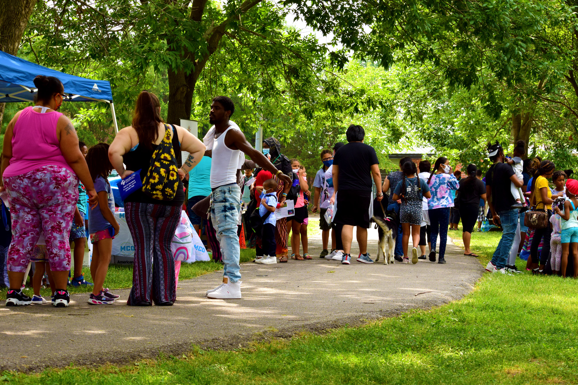 Crowds line up for backpacks and school supplies at Marquette Community Day in Dutchtown, St. Louis, MO.