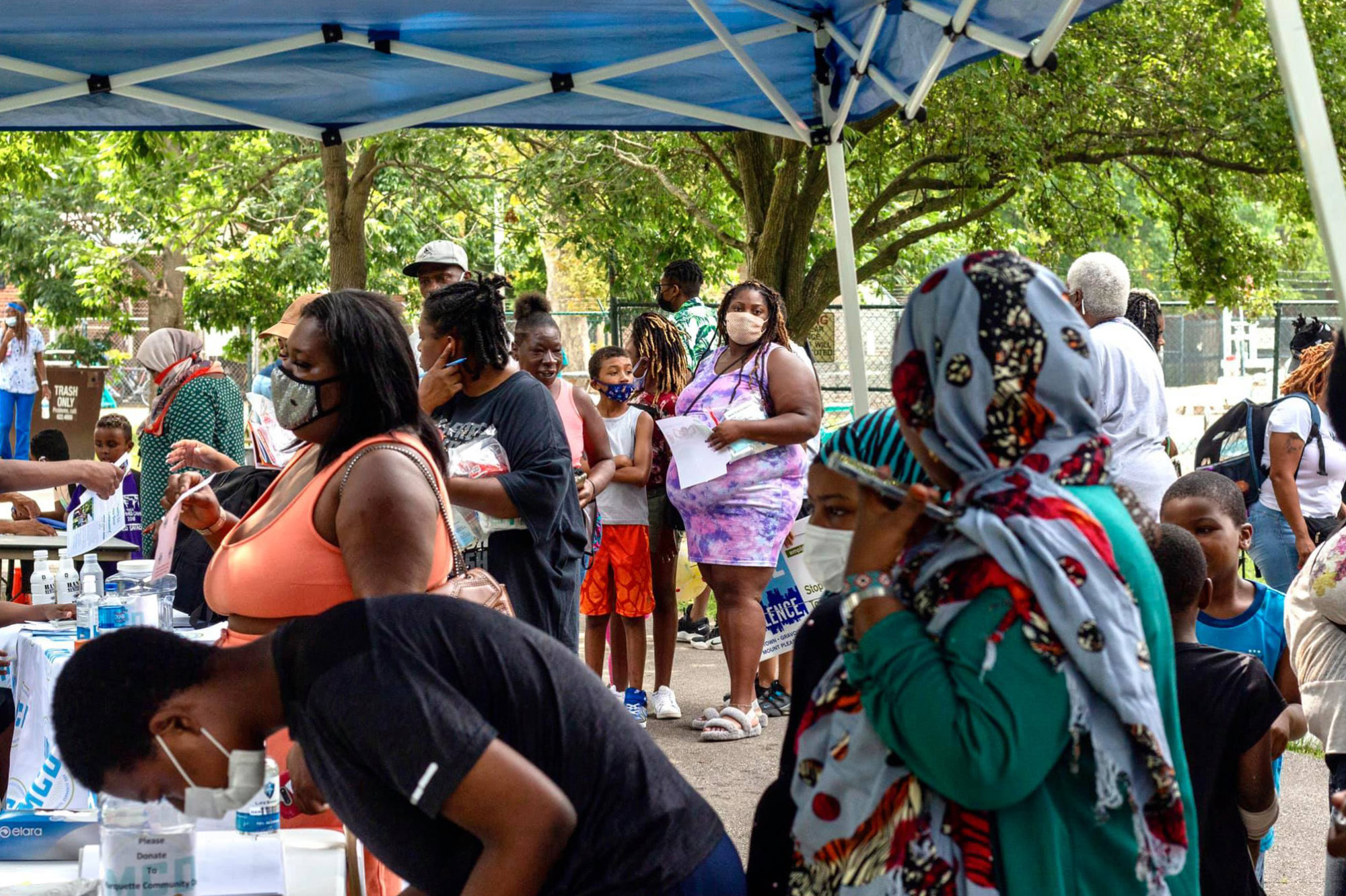 Crowds line up for backpacks and school supplies at Marquette Community Day in Dutchtown, St. Louis, MO.