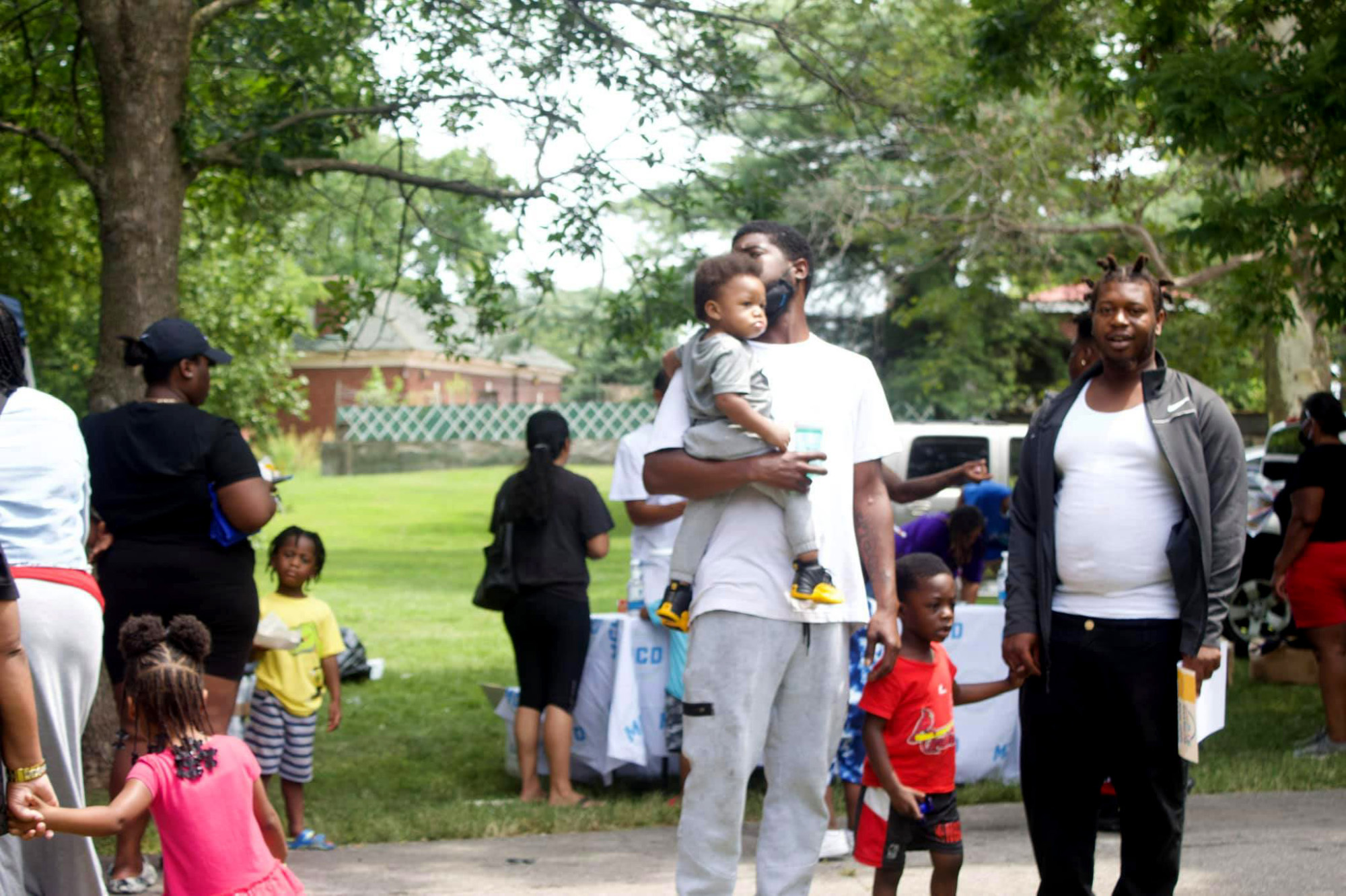 Crowds line up for backpacks and school supplies at Marquette Community Day in Dutchtown, St. Louis, MO.