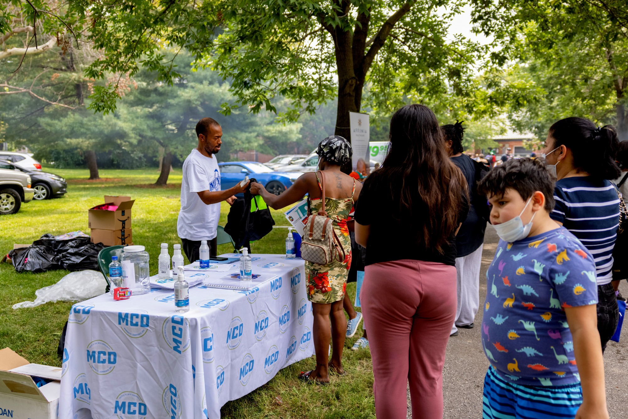 Crowds line up for backpacks and school supplies at Marquette Community Day in Dutchtown, St. Louis, MO.