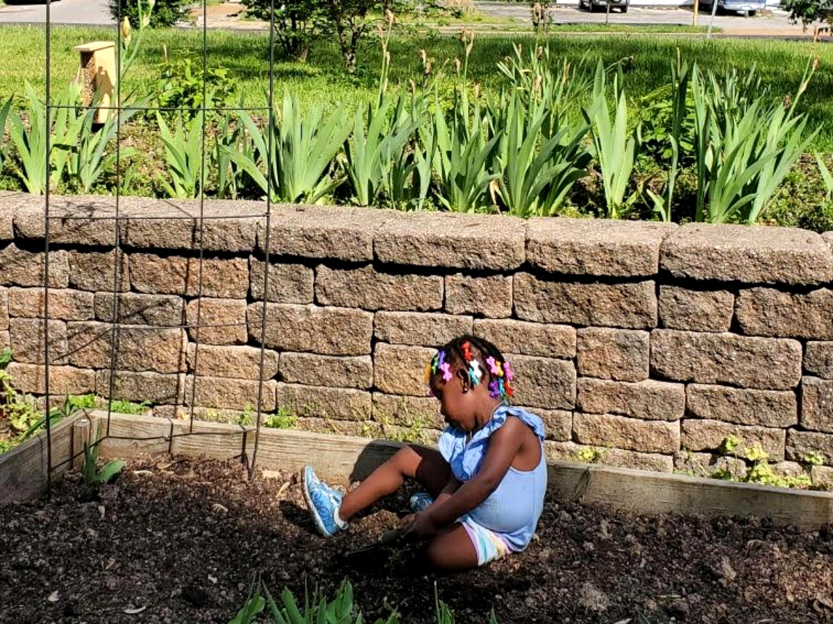 A young child at the VAL Garden in Dutchtown, St. Louis, MO.