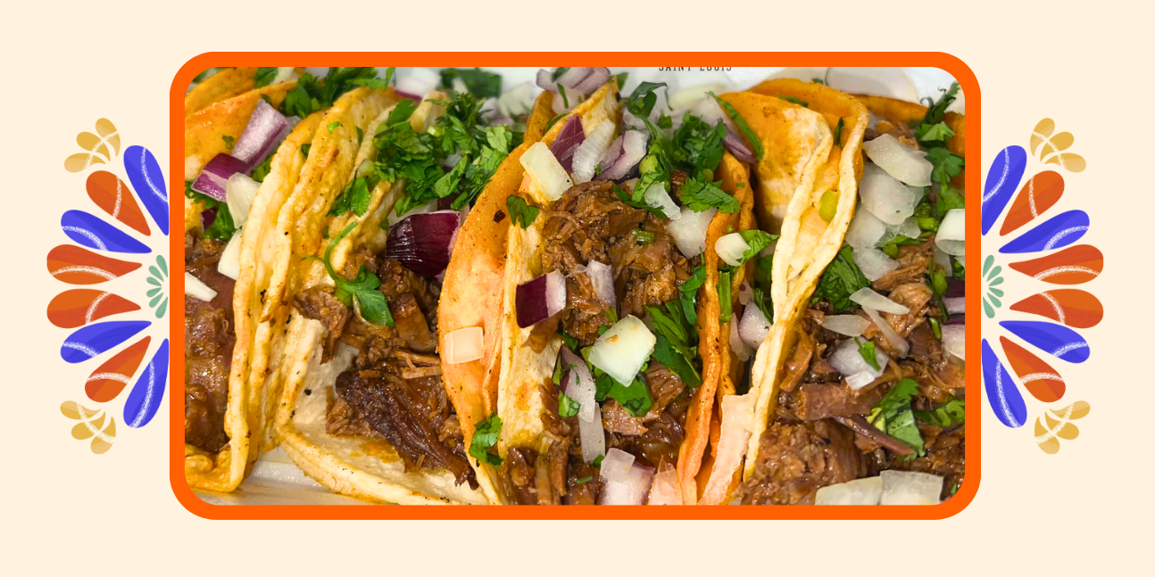 A photo of tacos on a colorful background.